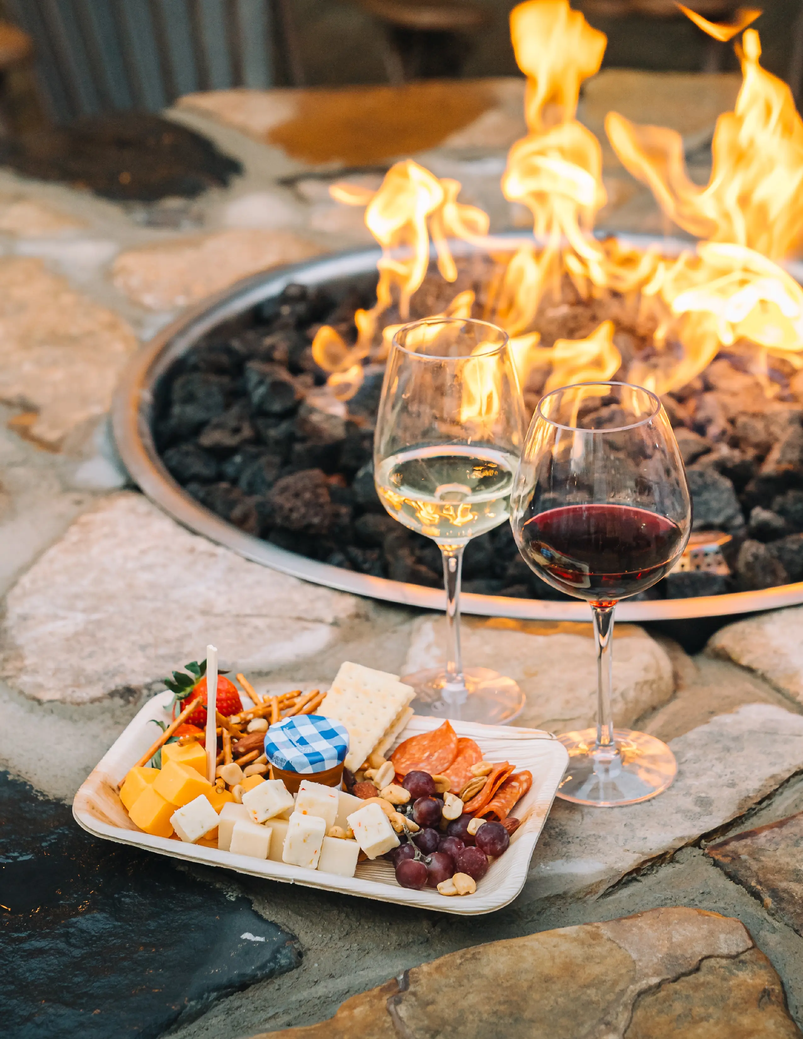 wine and cheese plate by the fire
